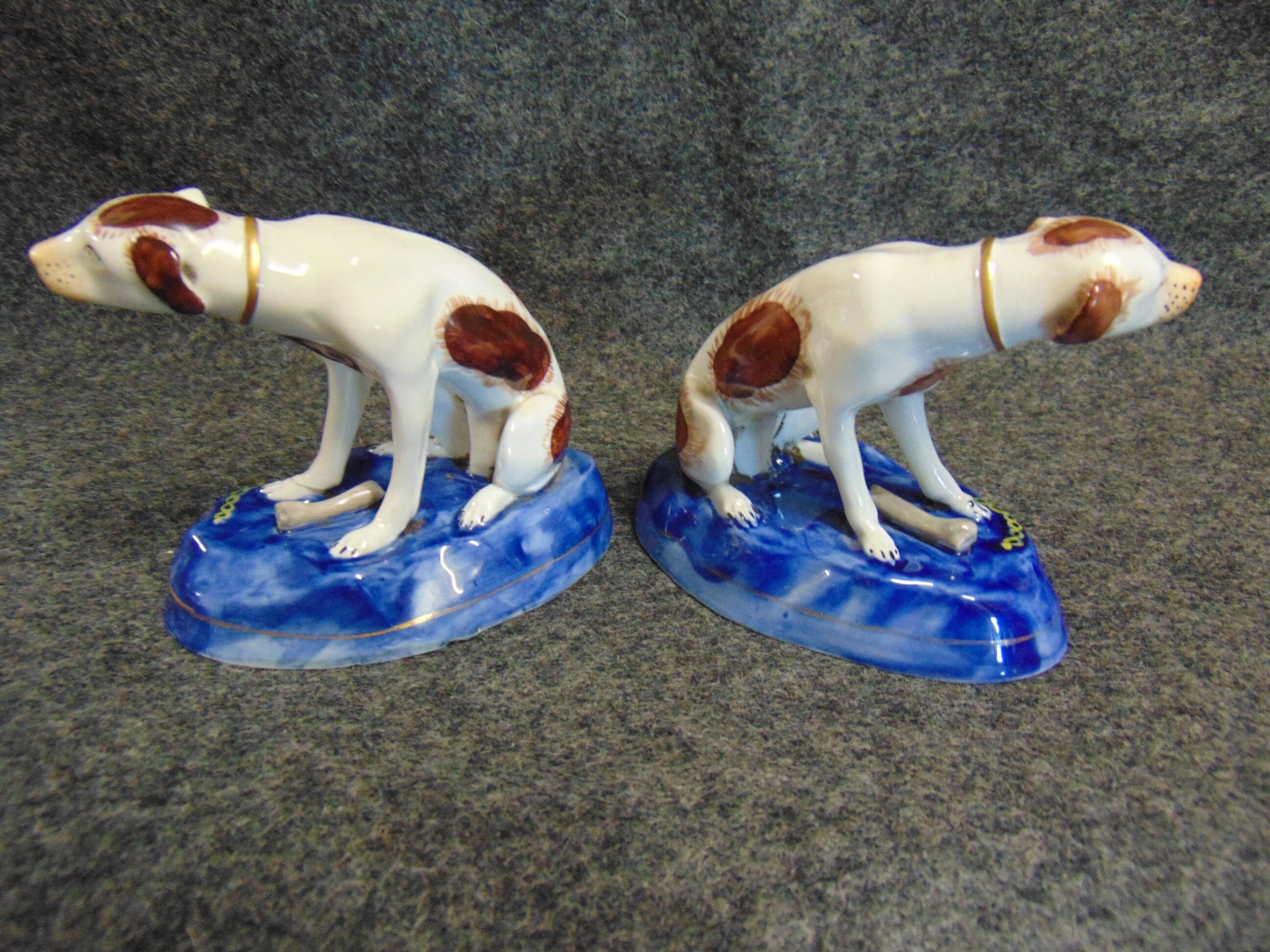 A Pair of Late 19th/early 20th Century Paris Porcelain Hunting Dogs